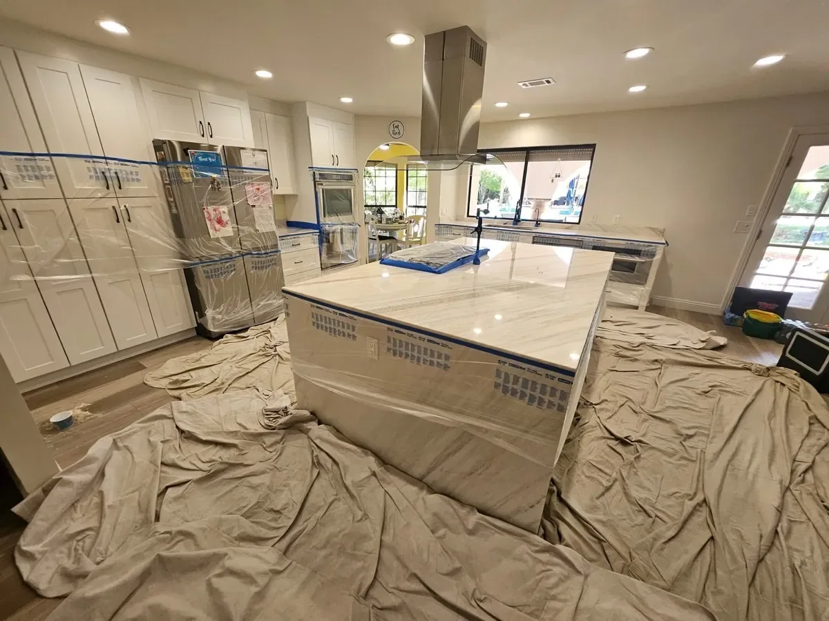 Marble kitchen island and countertops prepared for professional restoration