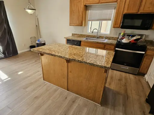 Granite kitchen countertop restored to an even polished finish