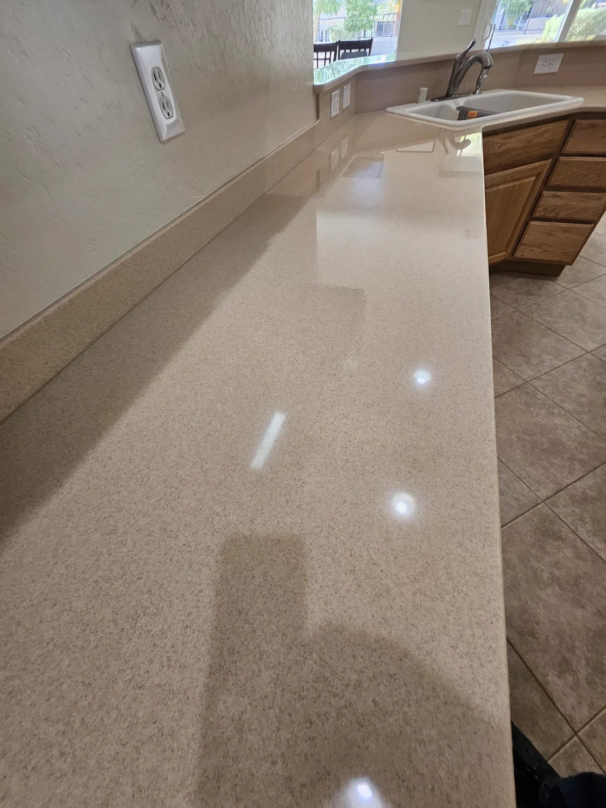 Finished Corian countertop beside an integrated sink