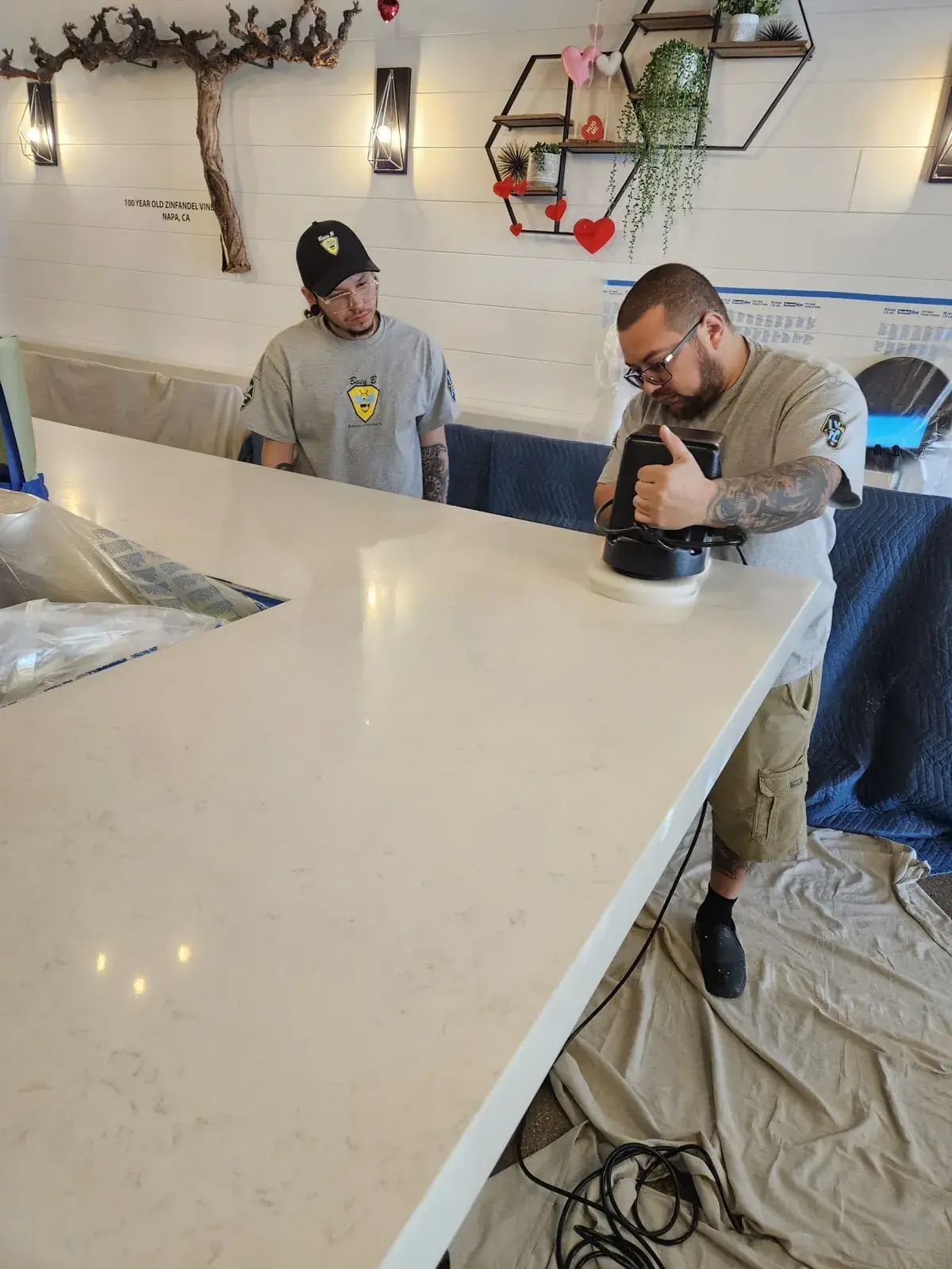 Professional quartz countertop polishing in progress