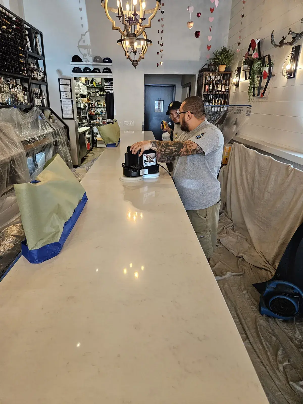Quartz countertop polishing at a protected commercial work area