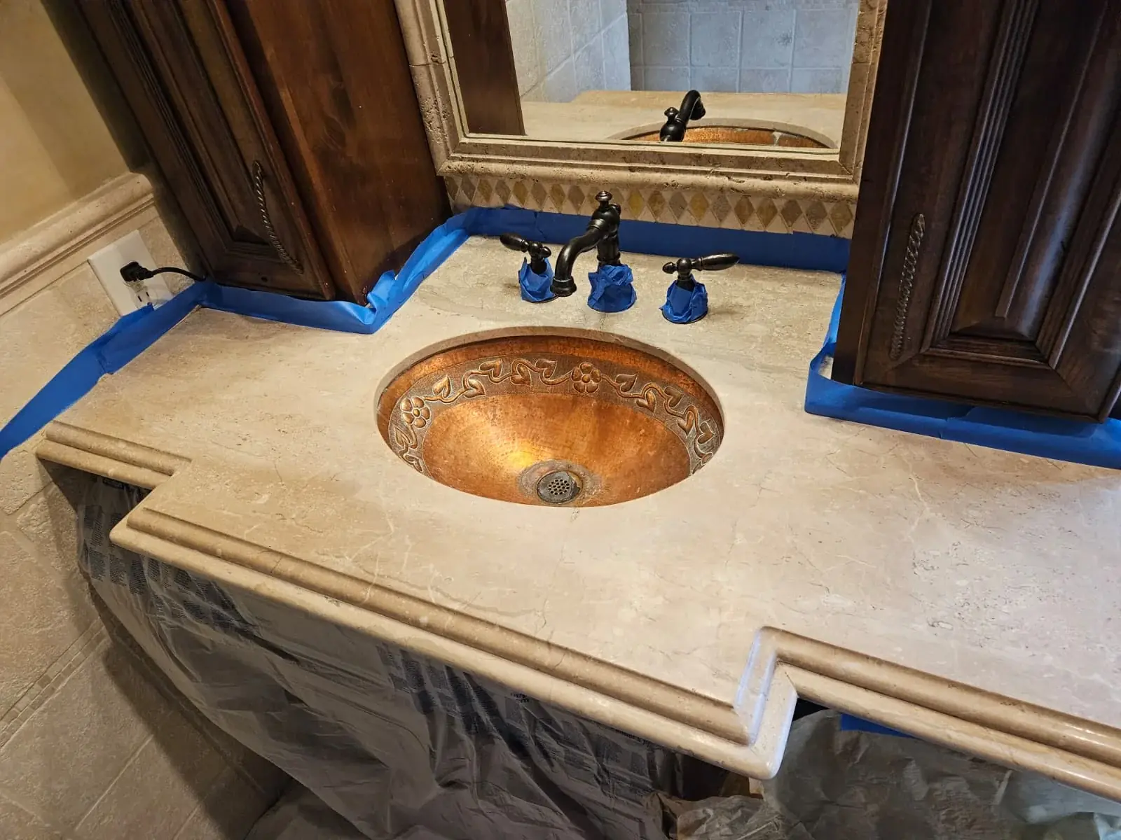 Travertine bathroom vanity prepared for professional restoration