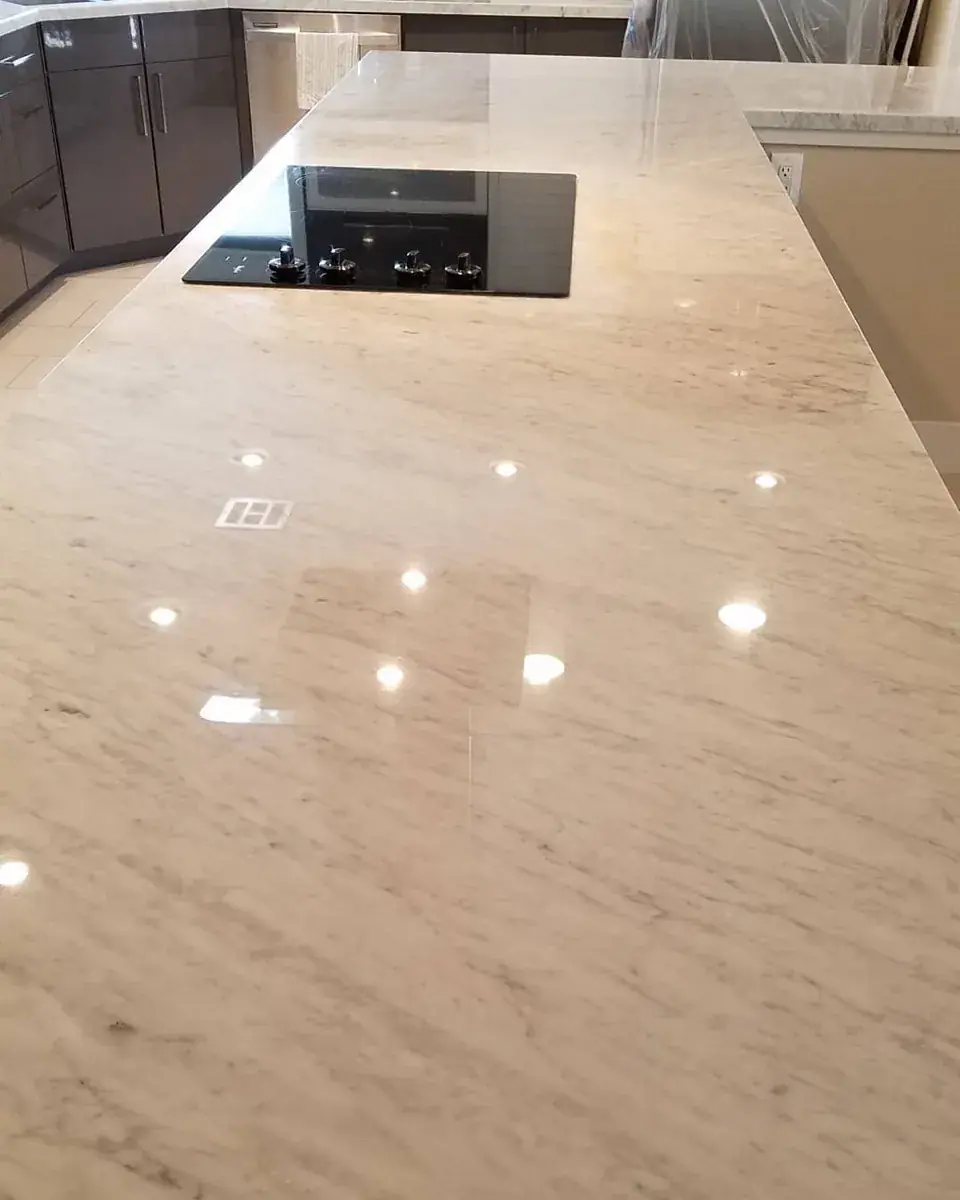 Polished Carrara marble island with an even reflection