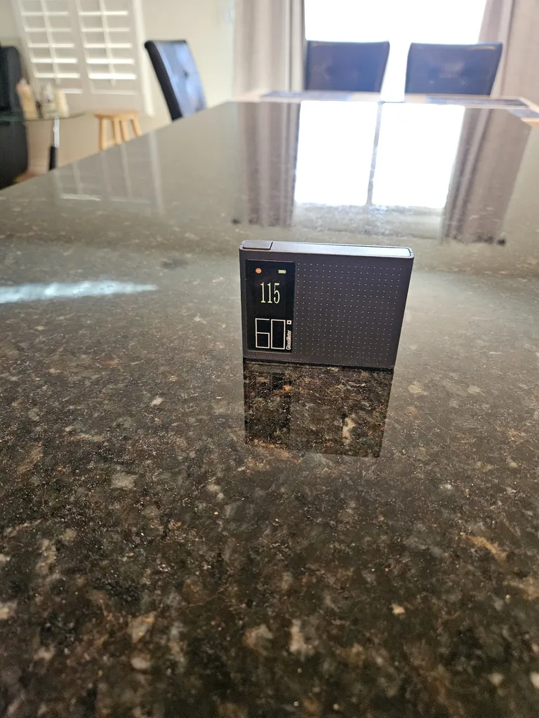 The same dark granite countertop after polishing with a gloss reading of 115