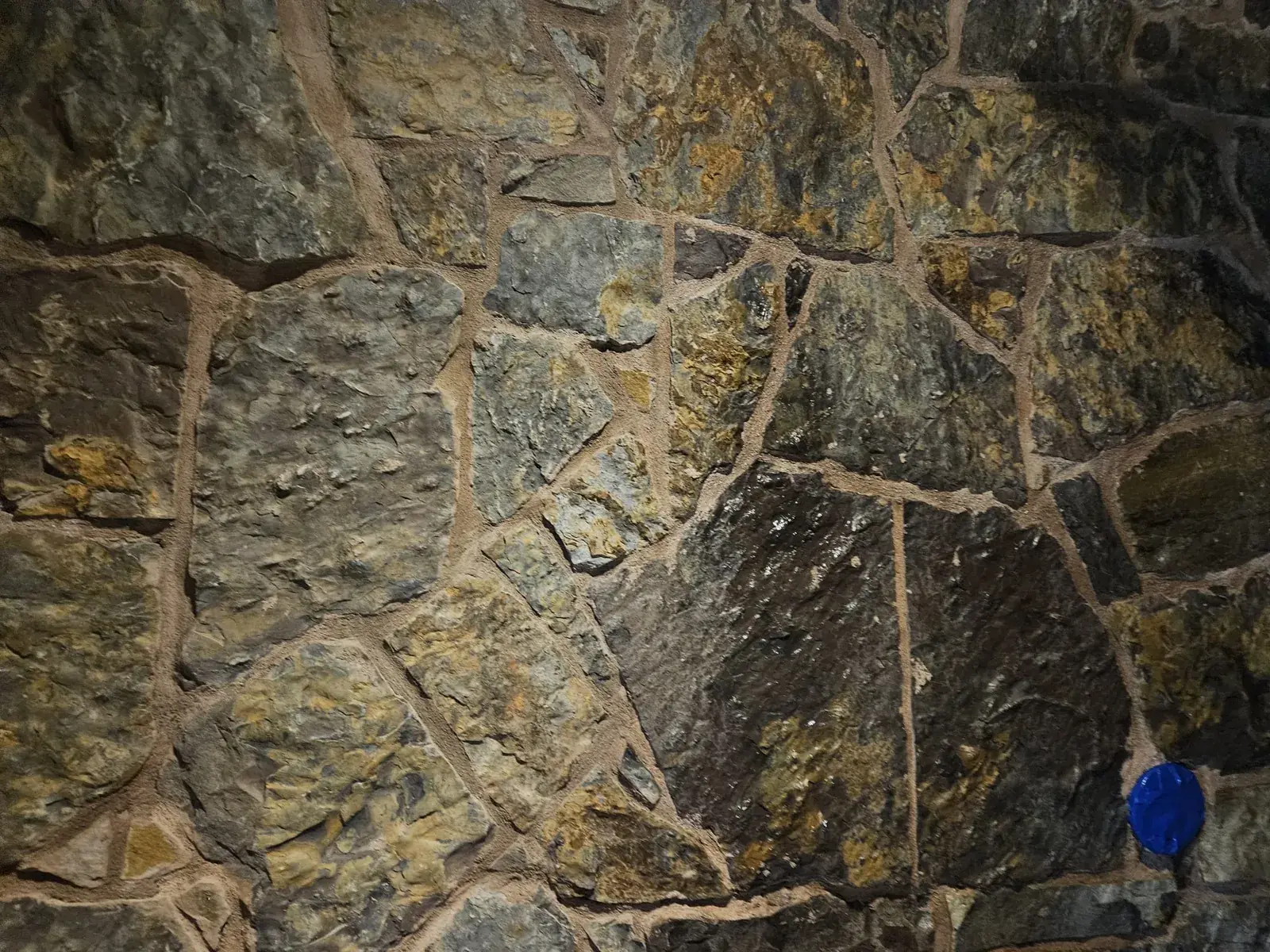 Close view of grout joints being evaluated during real surface work