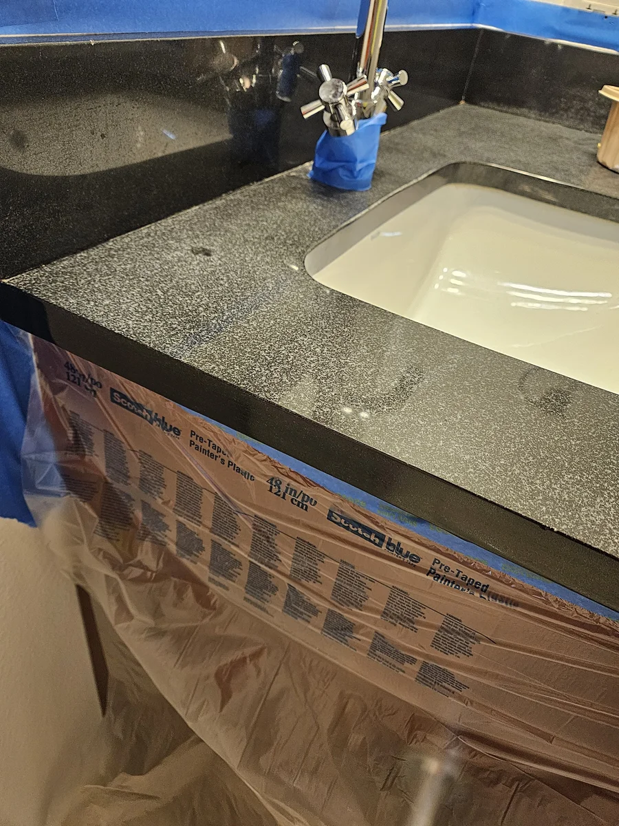 Real black granite vanity after a careful sealing and finishing service