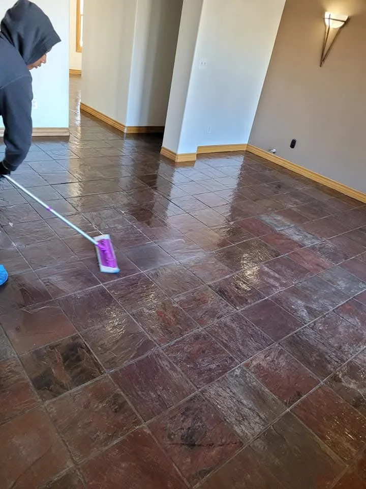 Slate floor polishing in progress with professional equipment