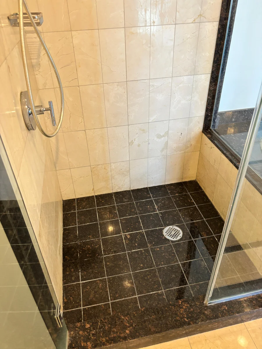 Real stone tile and grout after a completed shower restoration service