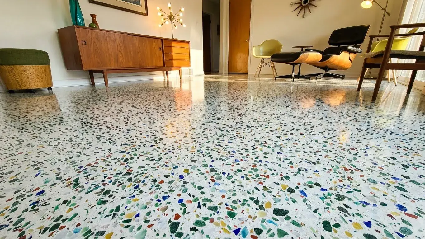 Restored terrazzo floor showing an even reflective finish in a furnished living space